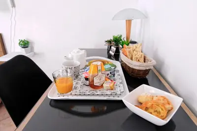 a table with a tray of food and drinks on it at Villa Louanne in Pertuis