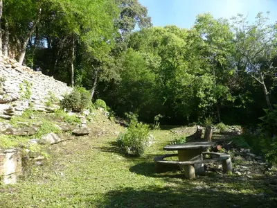 a picnic table sitting in the grass in a park at Belle De Jour -A Provencal gem Private heated pool in Gordes