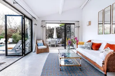 a living room with a couch and a glass table at Belle De Jour -A Provencal gem Private heated pool in Gordes