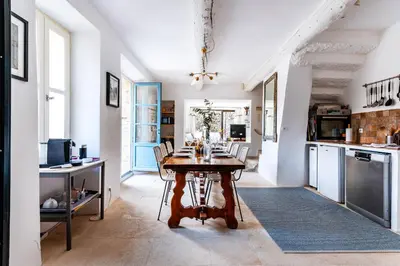 a kitchen with a table and chairs in a room at Belle De Jour -A Provencal gem Private heated pool in Gordes