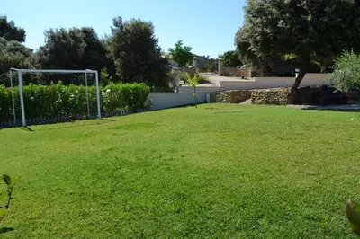 a soccer field with a soccer goal in a yard at La cubaine in Puget