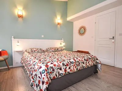 a bedroom with a bed with a colorful comforter at Holiday Home Luberon Vidauque by Interhome in Cavaillon