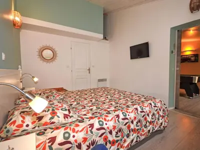 a bedroom with a bed with a colorful comforter at Holiday Home Luberon Vidauque by Interhome in Cavaillon