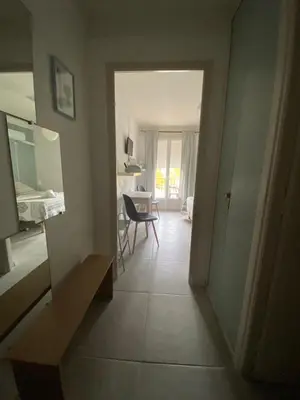 a bedroom with a bed and a table and a chair at Hotel Carina in Apt