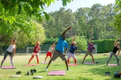 a group of people doing yoga in a park at VTF Les Florans in Bédoin