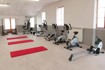 a gym with several exercise bikes and treadmills at VTF Les Florans in Bédoin