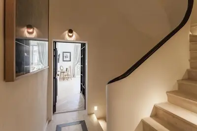 a staircase in a home with a curved stair case at Maison Du Collectionneur in Aix-en-Provence
