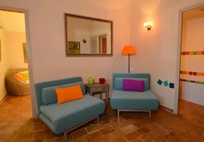 two chairs and a mirror in a room at La Tuilière en Luberon in Cadenet