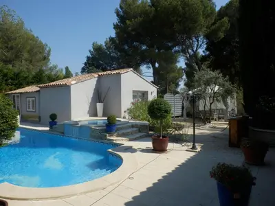 a swimming pool in front of a house at Gite Le city en Provence in Lambesc