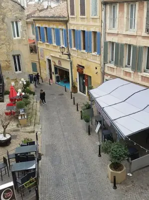 a building on a street with graffiti on it at le COIN salonais in Salon-de-Provence