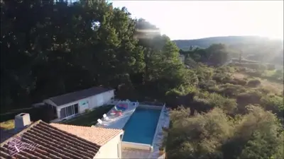 an aerial view of a house with a swimming pool at un lit en provence in Éguilles