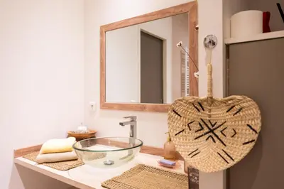 a bathroom with a sink and a mirror at Maison d’Etienne in Lacoste