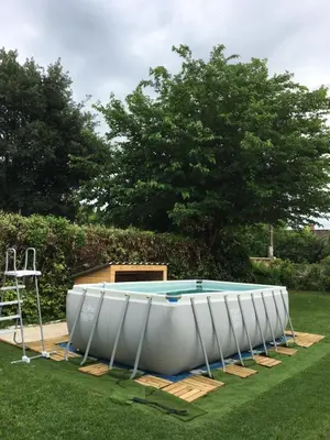 a large white tub sitting in the grass at Maison de village in Velleron