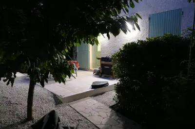 a courtyard with a bench in a building at Les Hauts De Reillanne in Reillanne