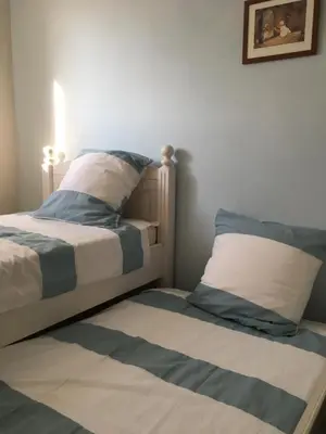 two beds sitting next to each other in a bedroom at Entre Vignes et Collines in Méthamis