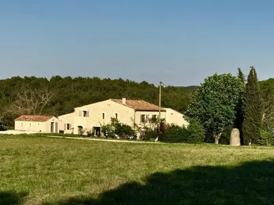 a large white house in a field with trees at Chut ! c'est ici in Venelles