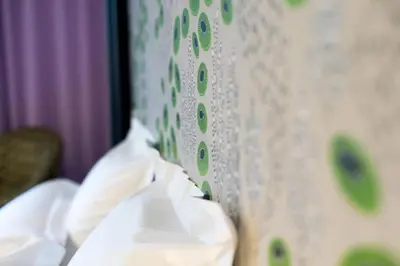 a close up of a curtain with flowers on it at Chut ! c'est ici in Venelles