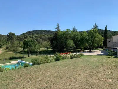 a backyard with a swimming pool and a garden at Chut ! c'est ici in Venelles