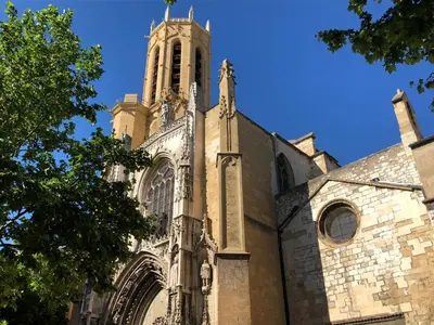 an old church with a tower on top of it at Aix Homes in Aix-en-Provence