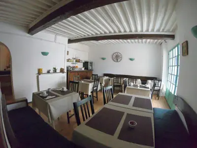 a dining room with a table and chairs at Le palais, hôtel - restaurant in Apt