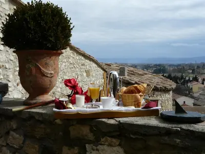 a table with food and drinks on a wall at Château de Vedène in Vedène