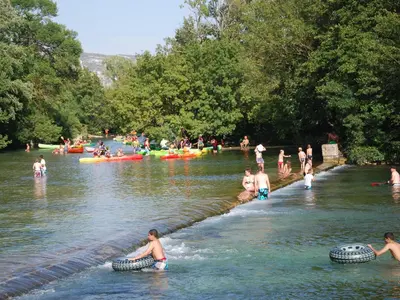 a group of people swimming in a river at Villa in Saumane near Golf Course and Pool in Saumane-de-Vaucluse
