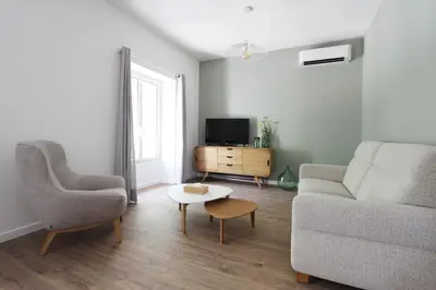 a living room with a couch and a table and a tv at 