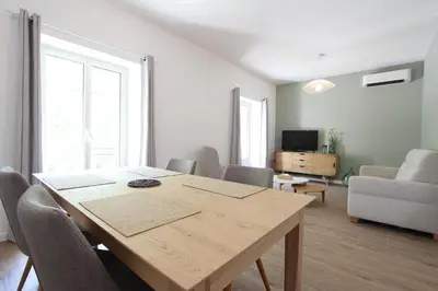 a living room with a wooden table and a couch at 