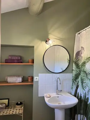 a bathroom with a sink and a mirror at Domaine La Condamine CRILLON LE BRAVE in Crillon-le-Brave