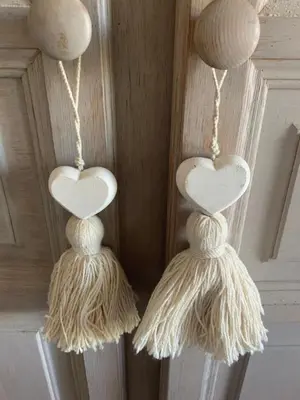 a pair of heart ornaments hanging on a wall at Domaine La Condamine CRILLON LE BRAVE in Crillon-le-Brave