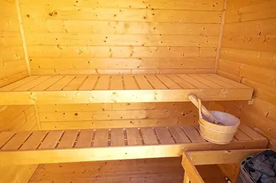 a wooden sauna with a bucket in it at Le Panorama des Alpilles in Aureille