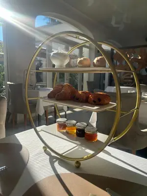 a display rack with pastries and jars of honey at Le Mas Angelussi - Le Clos du Soleil in Salon-de-Provence