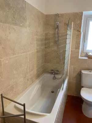 a bathroom with a bath tub and a toilet at Villa confortable à Caromb avec piscine privée in Caromb