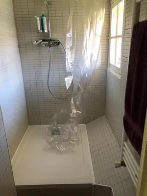a shower in a tiled bathroom with a tub at Villa Les Cedres in Aix-en-Provence