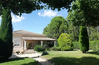 a house with a garden and trees at La Goutadou in Cabannes