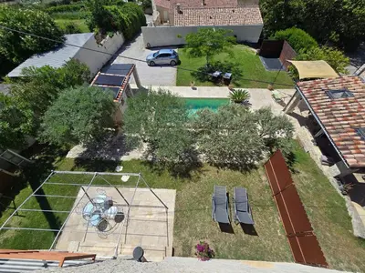 an aerial view of a yard with a swimming pool at Le Mas de la Tortue (Plain Pied) in Caromb