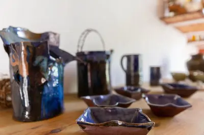 a group of bowls sitting on top of a table at Poterie de Pierroux in Roussillon