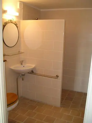 a bathroom with a sink and a toilet and a mirror at Olivier in Mazan