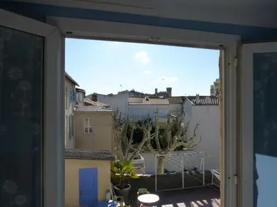 a view of a city from a window at Hotel Régina in Salon-de-Provence