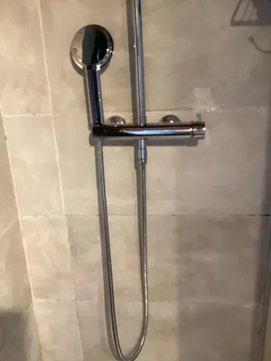 a shower with a shower head in a bathroom at 196 rue des moulins in Vachères