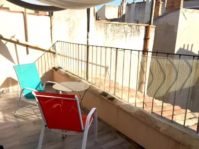 two chairs and a table on a balcony at Studio avec Terrasse in Aix-en-Provence