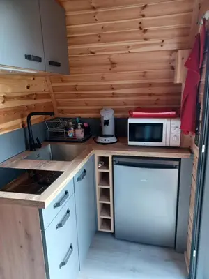 a small kitchen with a stove and a microwave at Domaine de Villemus in Jouques