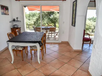 a dining room with a table and chairs at Villa La Chênaie by Interhome in Saumane-de-Vaucluse