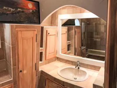 a bathroom with a sink and a mirror at Villa La Chênaie by Interhome in Saumane-de-Vaucluse