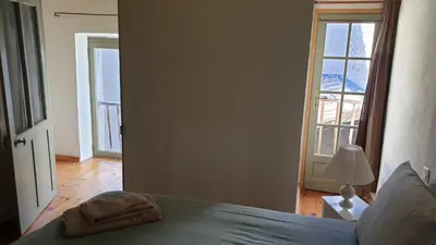 a bedroom with a bed with a towel on it at la bastide de l'adrech in Manosque