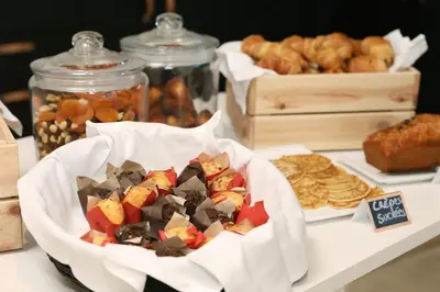 a table topped with a bowl of cookies and pastries at Le Néliö in Aix-en-Provence