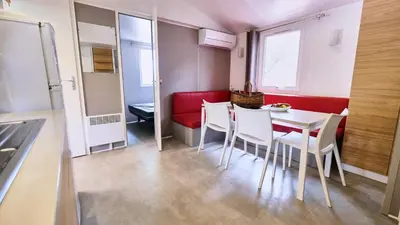 a kitchen and dining room with a table and chairs at Domaine Les Chênes Blancs in Saint-Saturnin-les-Apt
