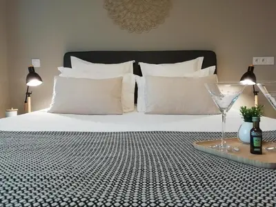 a tray with two cups and trees on a bed at Sweet Home Studio Aix en Pce, clim,terrasse,piscine,pkg gratuit in Aix-en-Provence