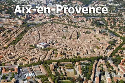 a garden with pink flowers and a building at Sweet Home Studio Aix en Pce, clim,terrasse,piscine,pkg gratuit in Aix-en-Provence