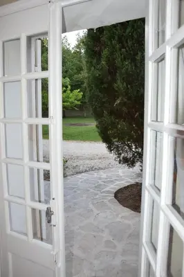 an open door leading to a walkway at Moulin des Gypses Gîte Les Pierres Blanches, Ventoux in Mormoiron